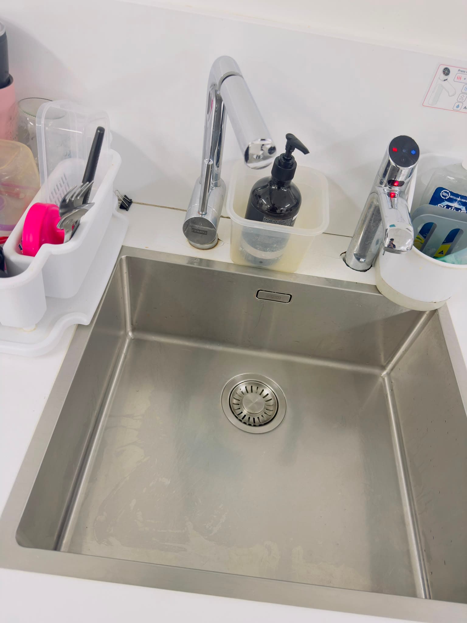 The same kitchenette sink polished spotless after cleaning