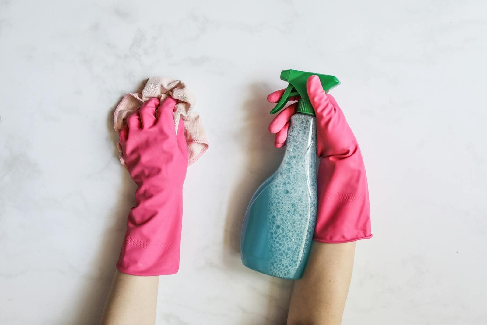 Detailed end-of-lease clean, cleaning products in hand
