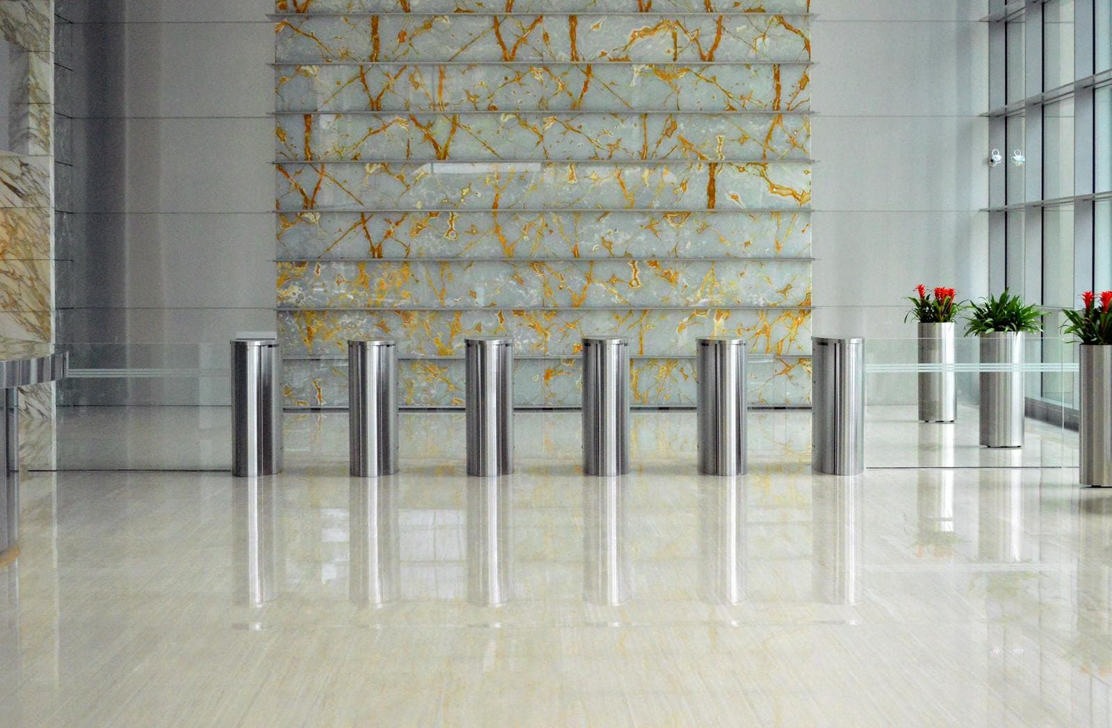 Sleek civic building lobby with marble walls and glass