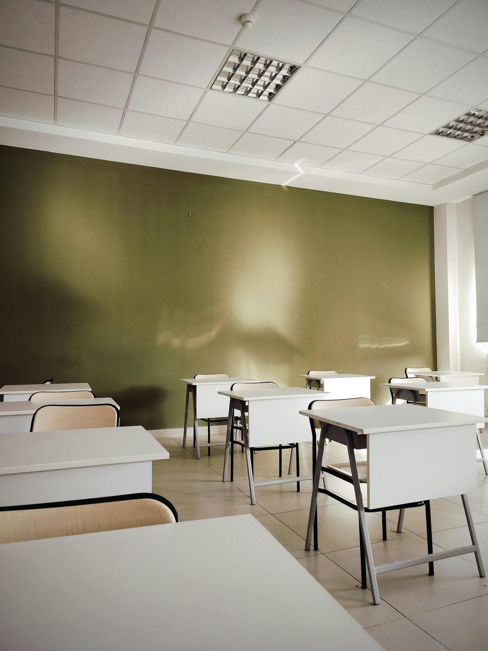 Bright, freshly cleaned classroom with rows of desks